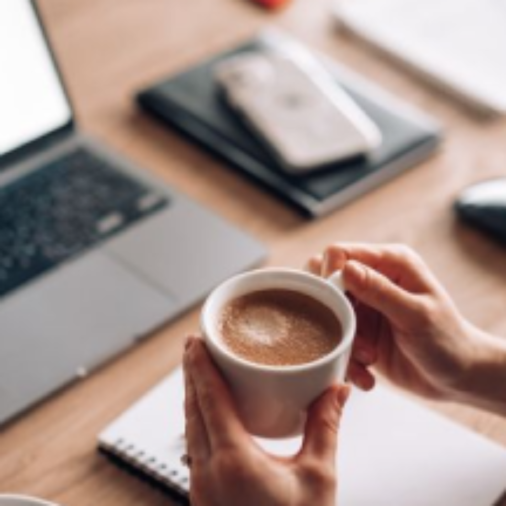 woman-holding-a-cup-of-coffee-at-work-home-office